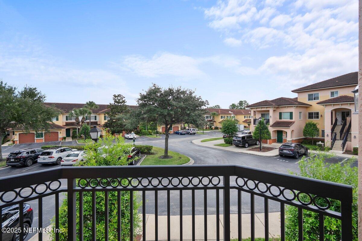 9745 Touchton Road, Unit 2421 Jacksonville, FL 32246 - Photo 13 of 26 a city view from a balcony and car parked