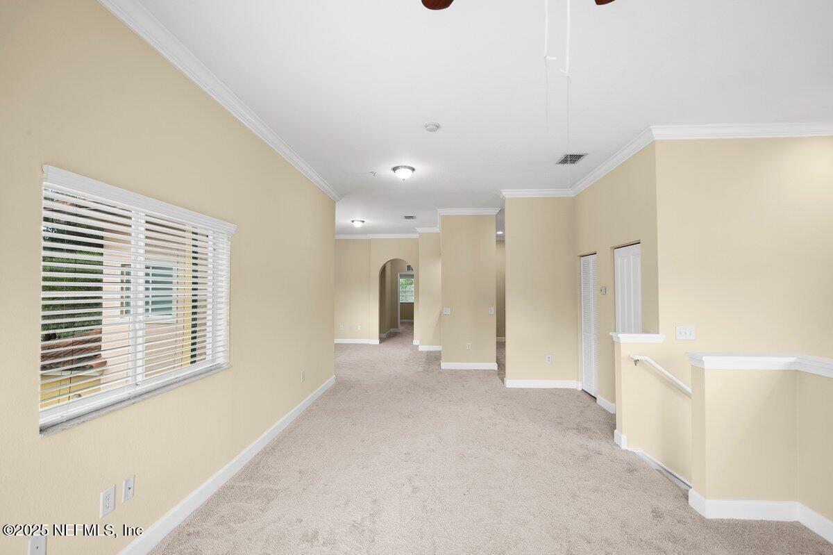 9745 Touchton Road, Unit 2421 Jacksonville, FL 32246 - Photo 4 of 26 a view of an empty room with a window