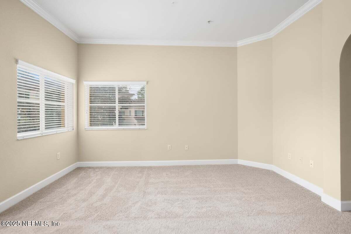 9745 Touchton Road, Unit 2421 Jacksonville, FL 32246 - Photo 8 of 26 a view of an empty room with a window