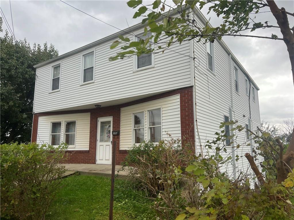 286 East Main Street Mount Pleasant, PA 15666 - Photo 1 of 30 a front view of a house with a garden
