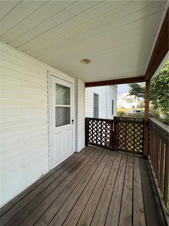 286 East Main Street Mount Pleasant, PA 15666 - Photo 15 of 30 a view of a balcony with wooden floor