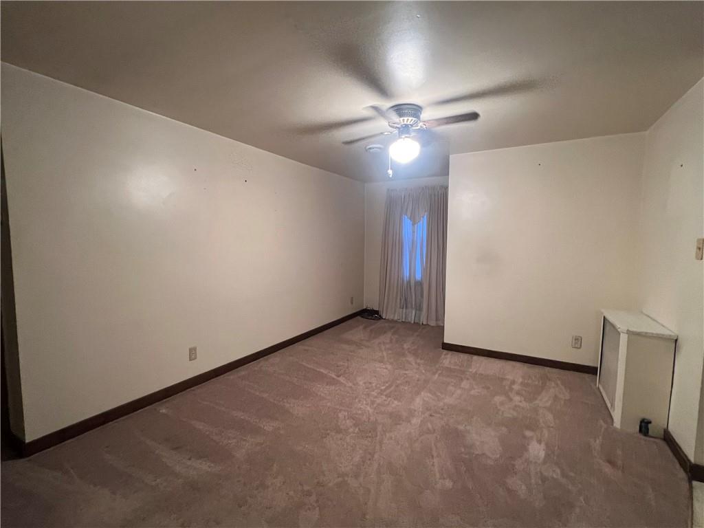 286 East Main Street Mount Pleasant, PA 15666 - Photo 17 of 30 an empty room with chandelier fan and a fan