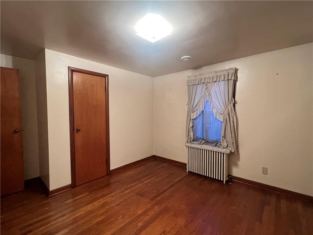 286 East Main Street Mount Pleasant, PA 15666 - Photo 20 of 30 an empty room with wooden floor and entryway