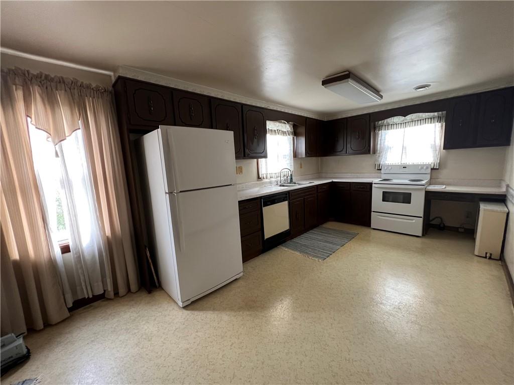 286 East Main Street Mount Pleasant, PA 15666 - Photo 2 of 30 a large kitchen with stainless steel appliances granite countertop a refrigerator a stove a sink dishwasher and a refrigerator