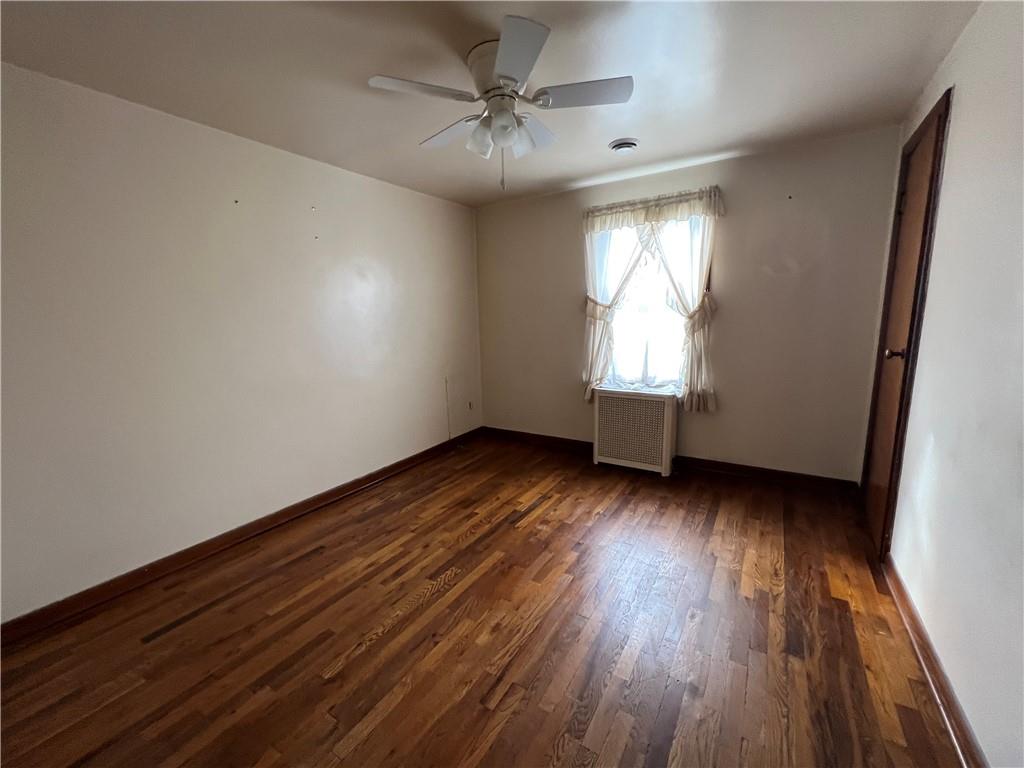 286 East Main Street Mount Pleasant, PA 15666 - Photo 21 of 30 an empty room with wooden floor and windows