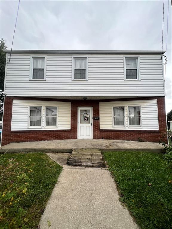286 East Main Street Mount Pleasant, PA 15666 - Photo 4 of 30 a front view of a house with a yard