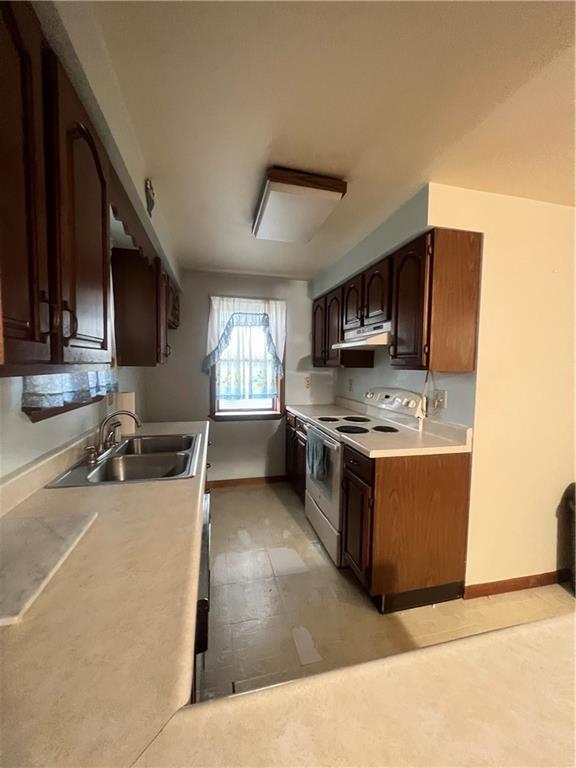 286 East Main Street Mount Pleasant, PA 15666 - Photo 9 of 30 a kitchen with stainless steel appliances granite countertop a sink stove and microwave
