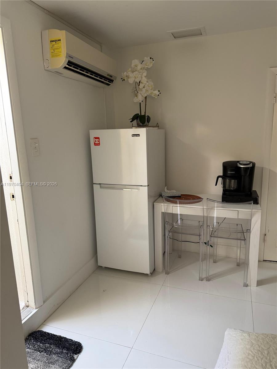 45 Southwest 28th Road Miami, FL 33129 - Photo 13 of 16 a refrigerator freezer sitting inside of a kitchen