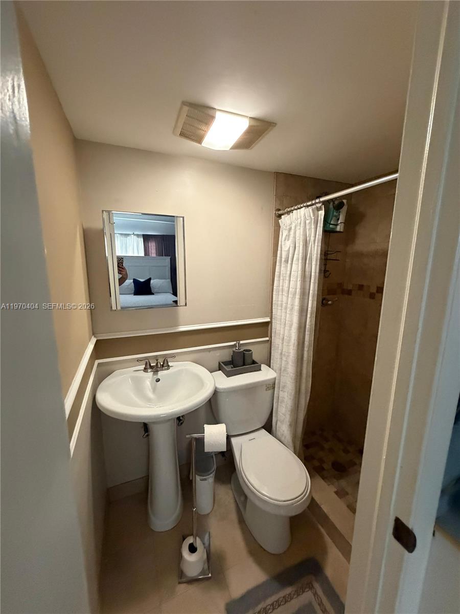 45 Southwest 28th Road Miami, FL 33129 - Photo 2 of 16 a bathroom with a sink toilet and shower