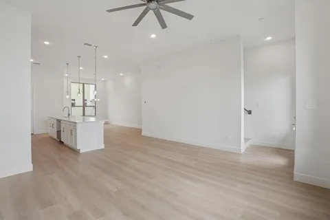 a view of kitchen with refrigerator and window