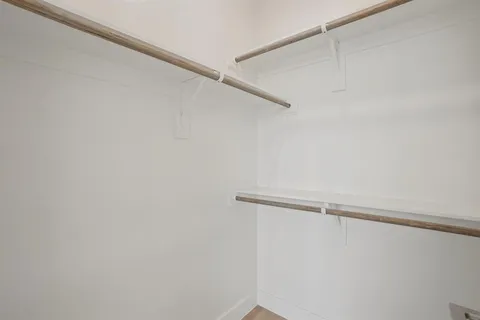 a view of a room with racks on the wall