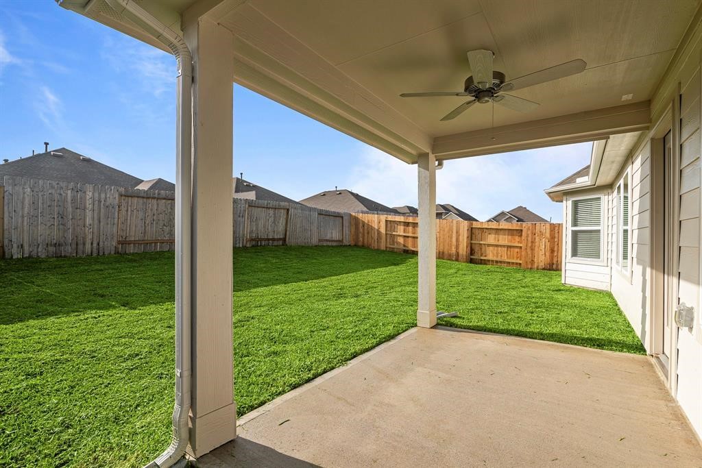 562 Bluebell Maiden Court Magnolia, TX 77354 - Photo 13 of 13 a view of a house with a big yard and garage