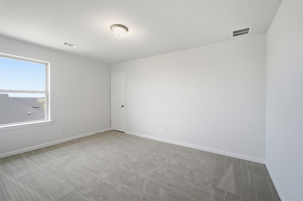 1908 Sangallo Lane Celina, TX 75009 - Photo 8 of 35 Carpeted room with a white door, single window, and ceiling light fixture
