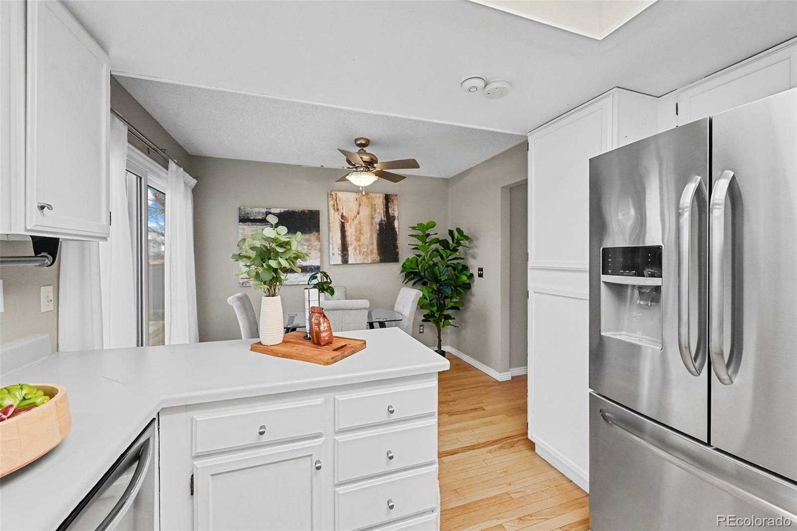 9170 Stargrass Circle Highlands Ranch, CO 80126 - Photo 14 of 39 a kitchen with a refrigerator and countertop