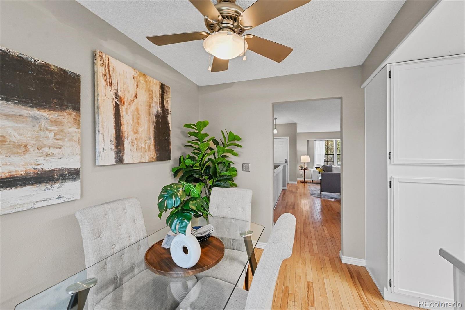 9170 Stargrass Circle Highlands Ranch, CO 80126 - Photo 16 of 39 a view of a dining room with furniture window and wooden floor
