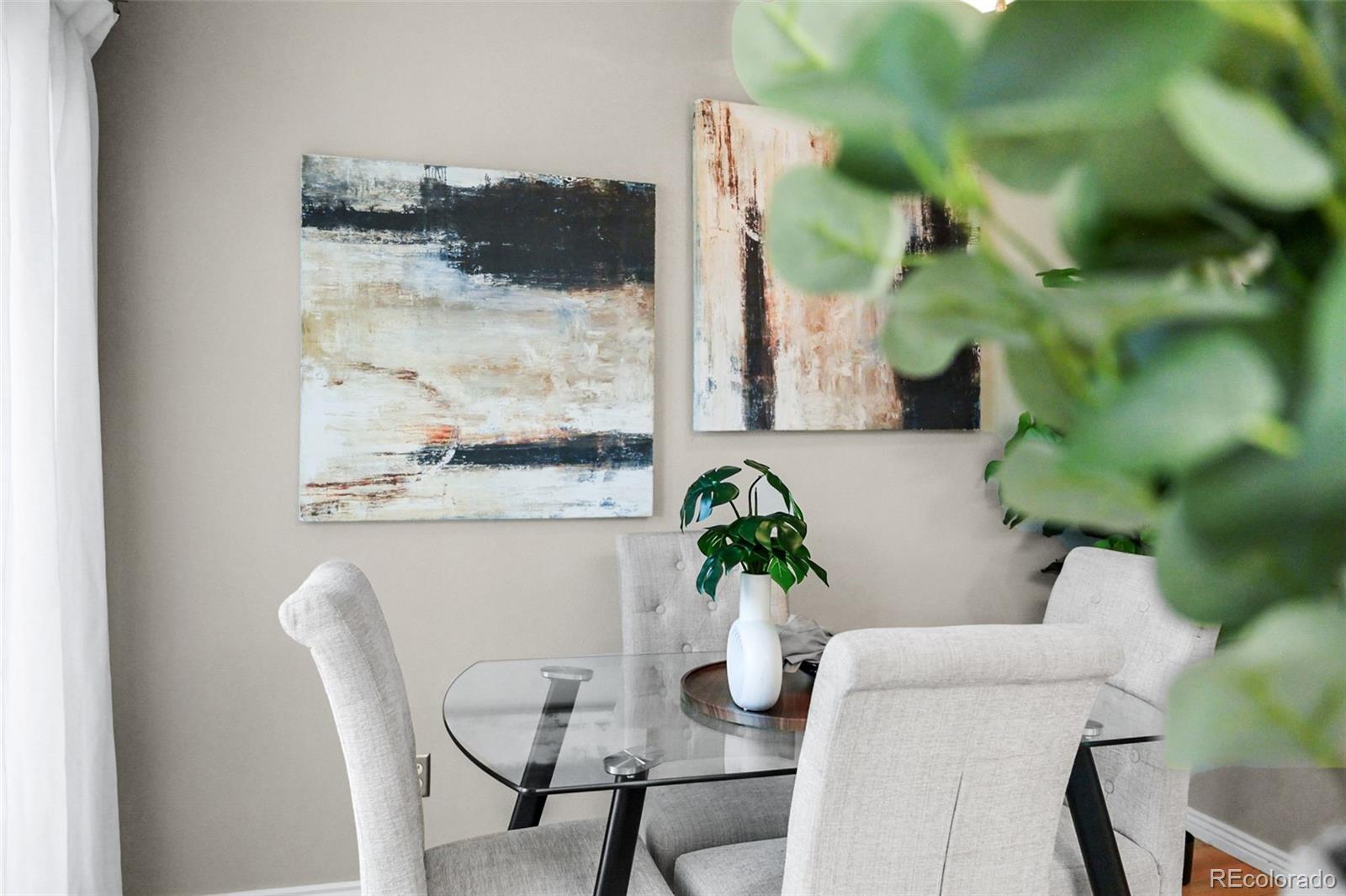9170 Stargrass Circle Highlands Ranch, CO 80126 - Photo 17 of 39 a dining room with furniture and wooden floor