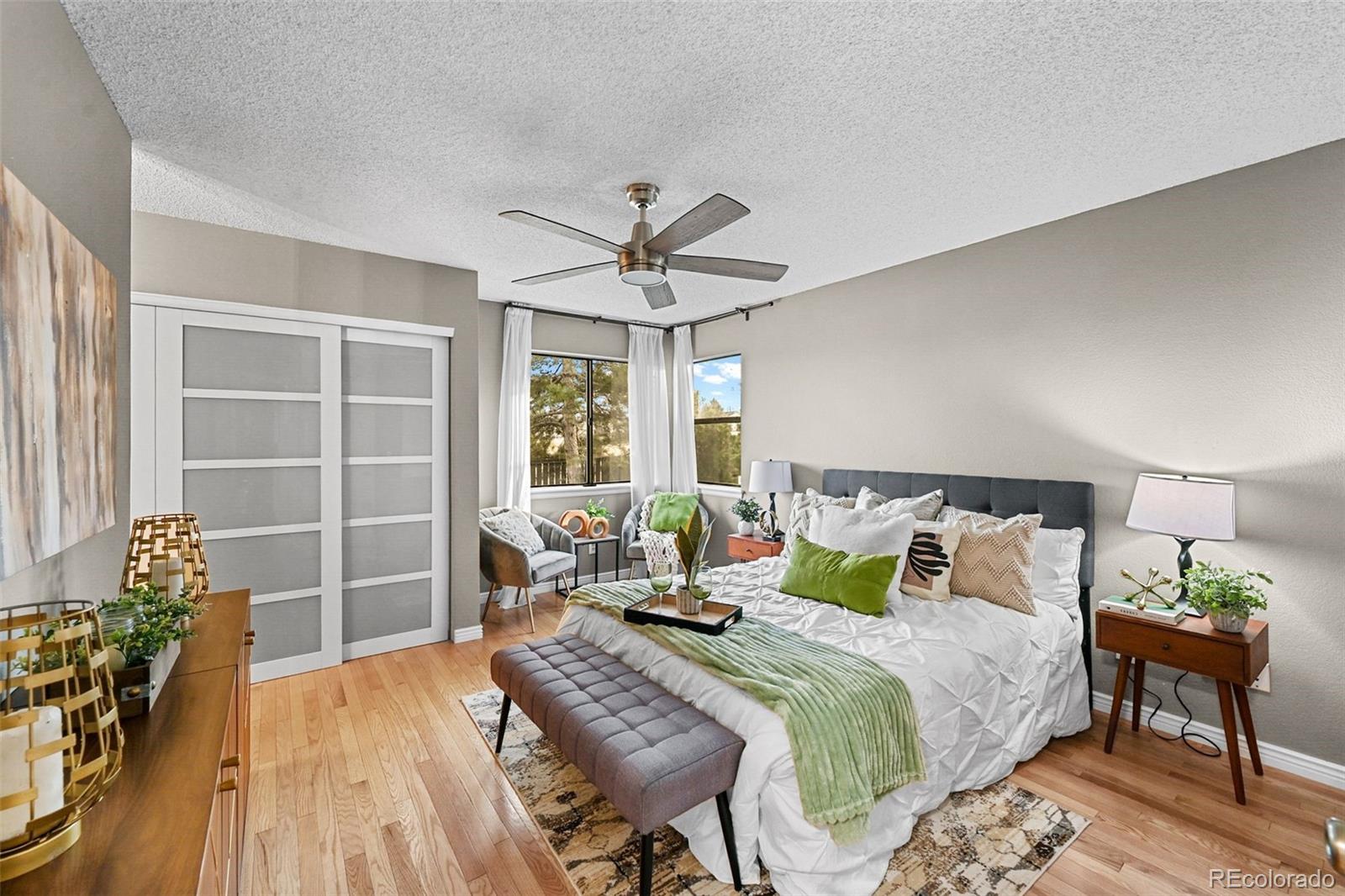 9170 Stargrass Circle Highlands Ranch, CO 80126 - Photo 20 of 39 a bedroom with a bed and wooden floor