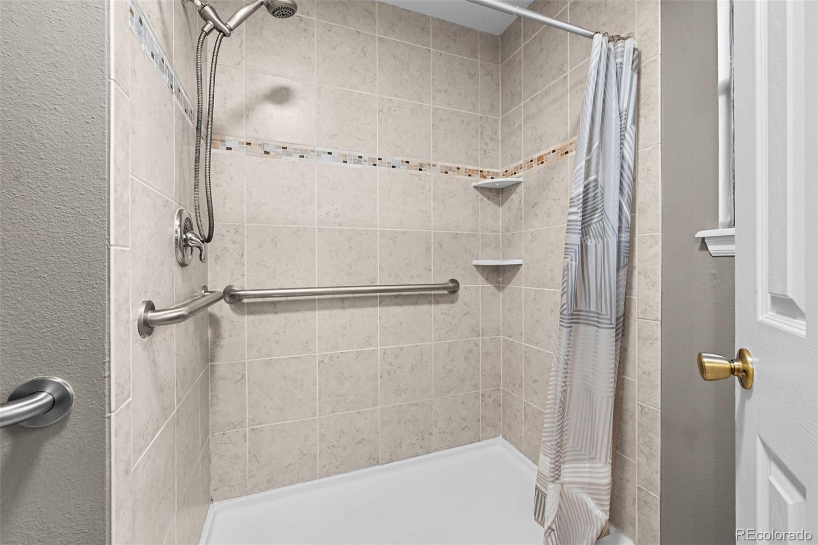 9170 Stargrass Circle Highlands Ranch, CO 80126 - Photo 22 of 39 a bathroom with a shower