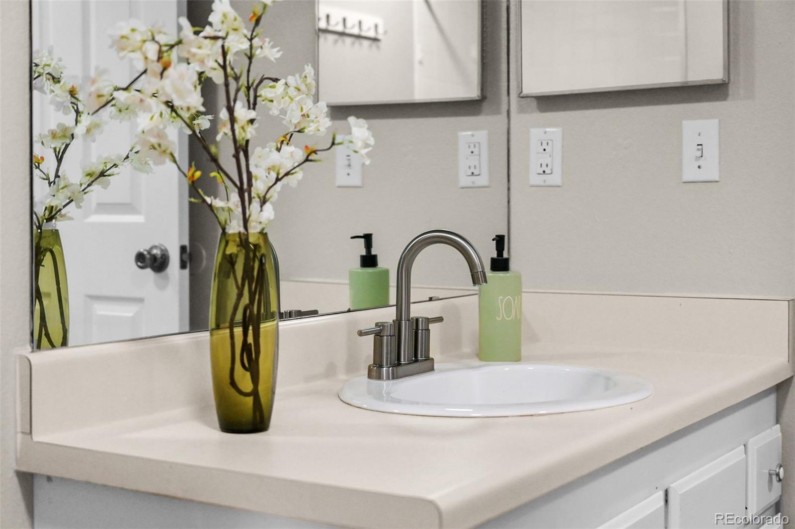 9170 Stargrass Circle Highlands Ranch, CO 80126 - Photo 25 of 39 a bathroom with a sink and a mirror