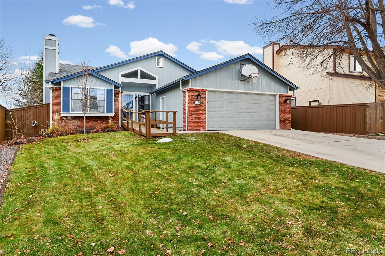 9170 Stargrass Circle Highlands Ranch, CO 80126 - Photo 6 of 39 a front view of house with yard and seating area