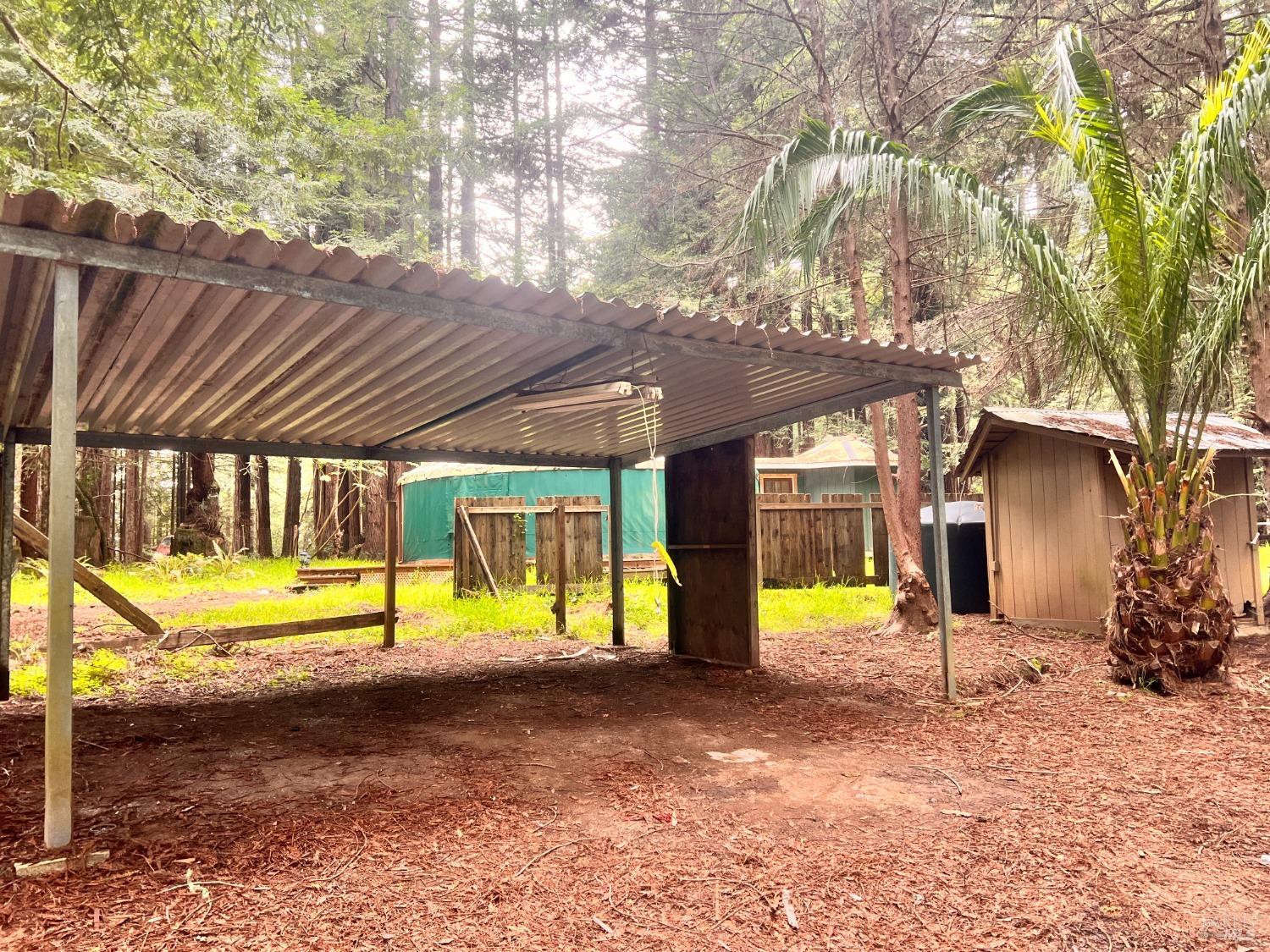 2300 Joy Road Occidental, CA 95465 - Photo 8 of 16 a view of a house with a backyard porch and sitting area