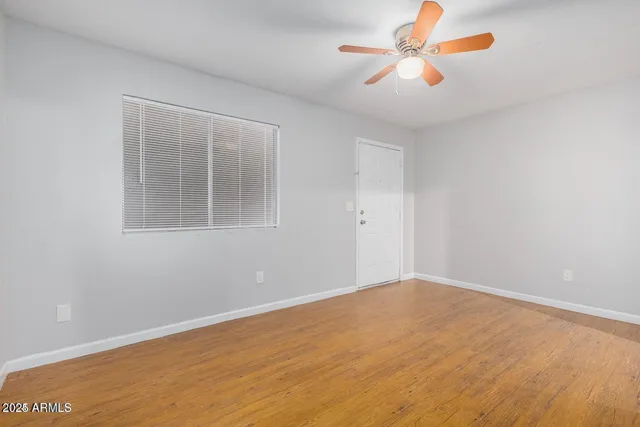 a view of an empty room with a window