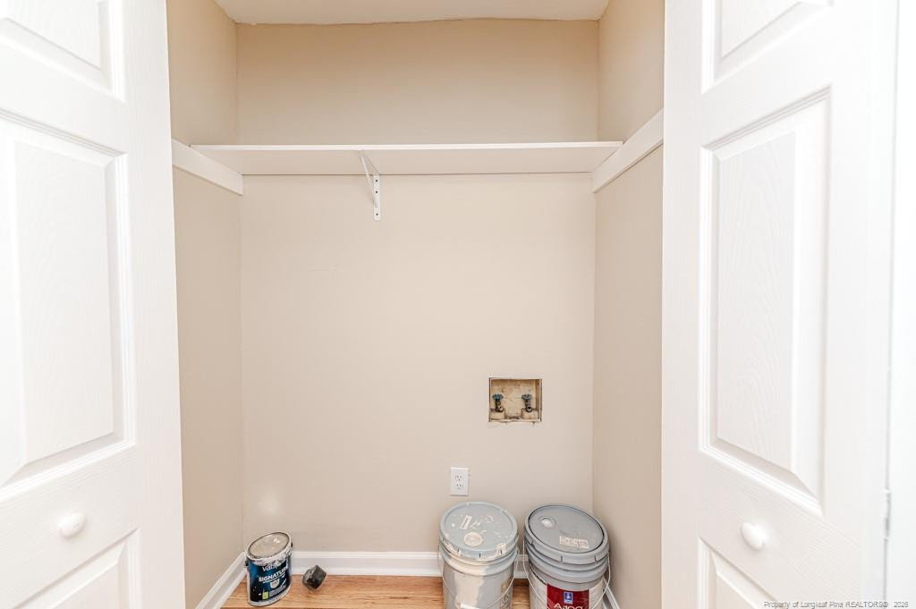 222 St Andrews Church Road Sanford, NC 27332 - Photo 17 of 24 a bathroom with a shower curtain and a sink