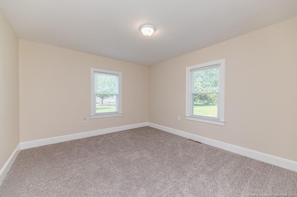 222 St Andrews Church Road Sanford, NC 27332 - Photo 18 of 24 an empty room with windows