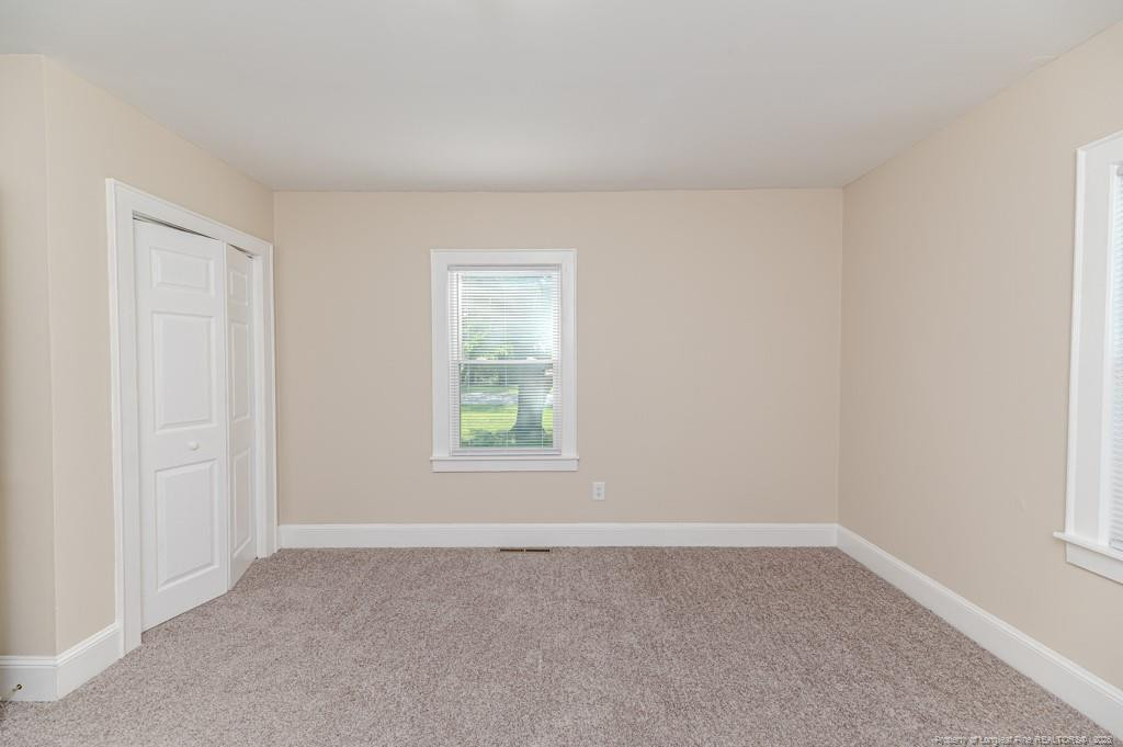 222 St Andrews Church Road Sanford, NC 27332 - Photo 20 of 24 an empty room with a window