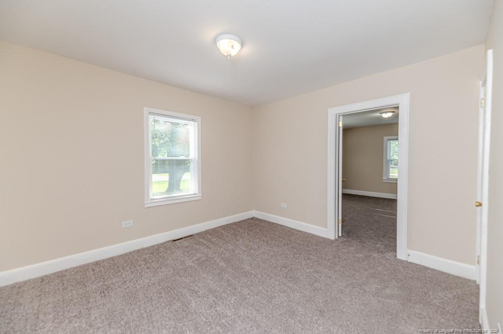 222 St Andrews Church Road Sanford, NC 27332 - Photo 23 of 24 an empty room with windows and closet