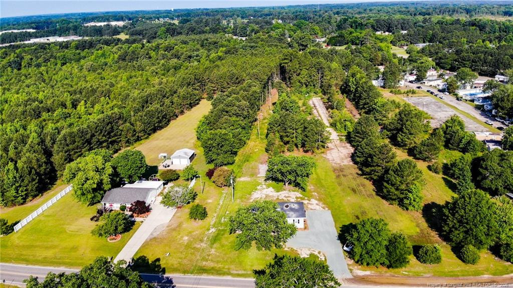 222 St Andrews Church Road Sanford, NC 27332 - Photo 3 of 24 an aerial view of residential houses with outdoor space and trees