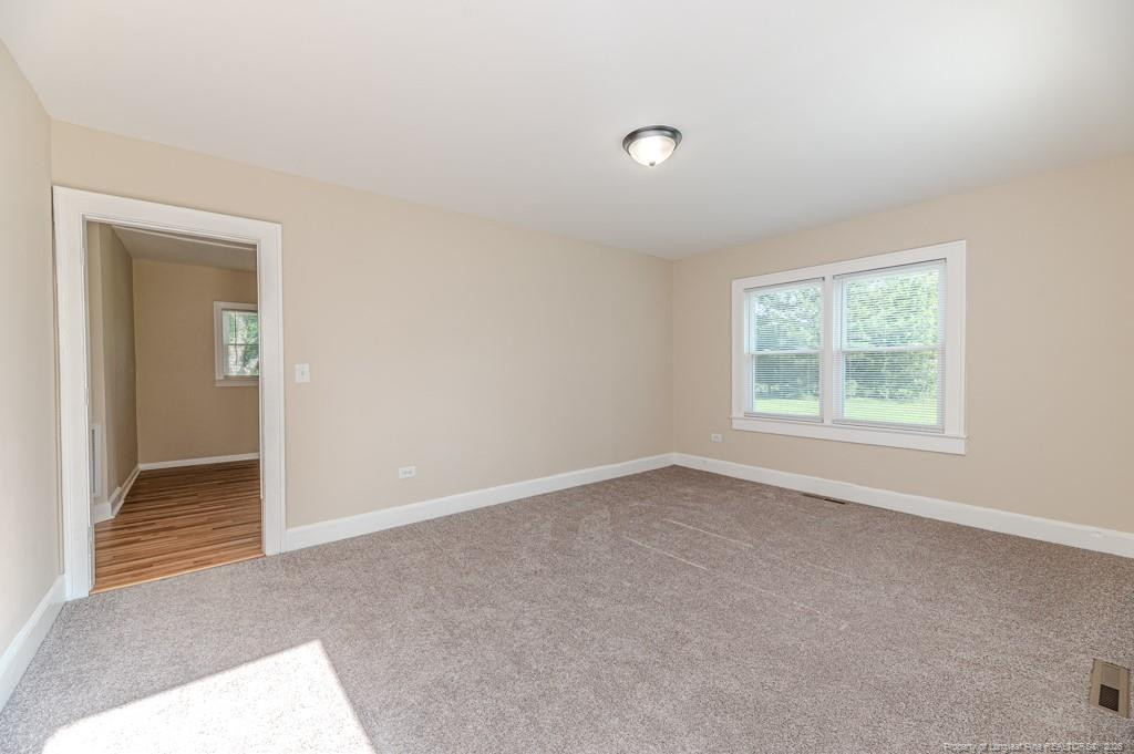 222 St Andrews Church Road Sanford, NC 27332 - Photo 9 of 24 an empty room with windows