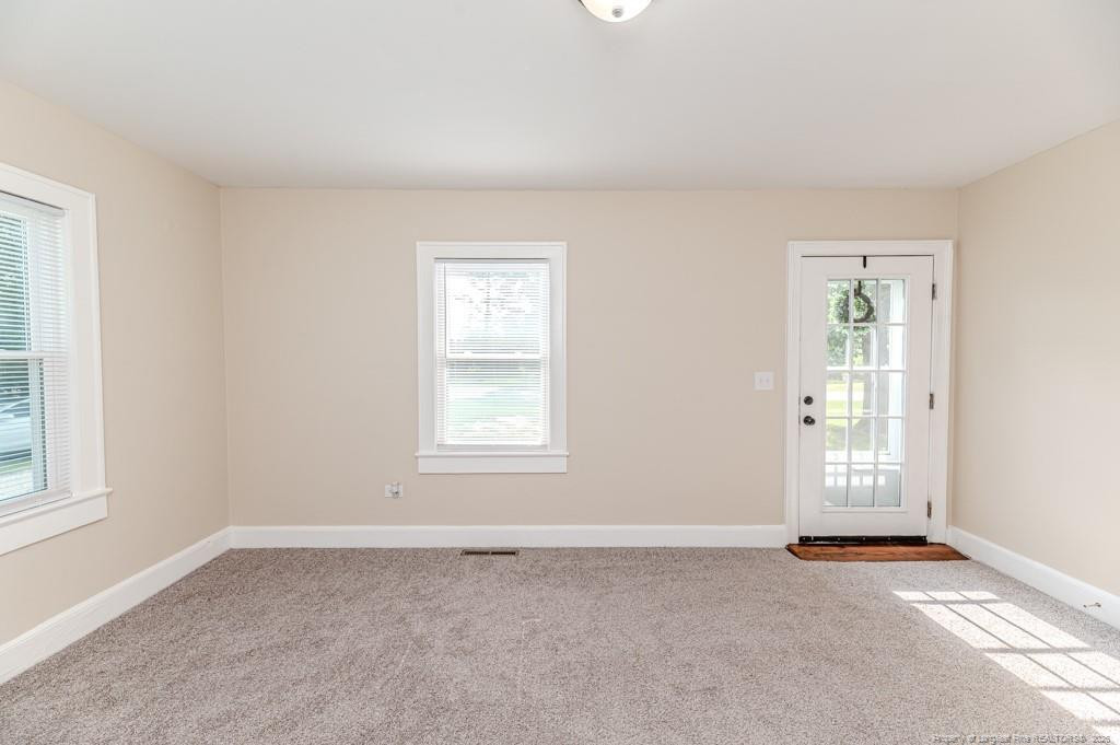 222 St Andrews Church Road Sanford, NC 27332 - Photo 10 of 24 an empty room with windows