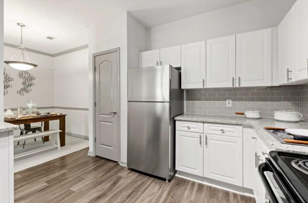 2100 Addison Lane, Unit 2127 Johns Creek, GA 30005 - Photo 1 of 25 a kitchen with stainless steel appliances a refrigerator stove and sink