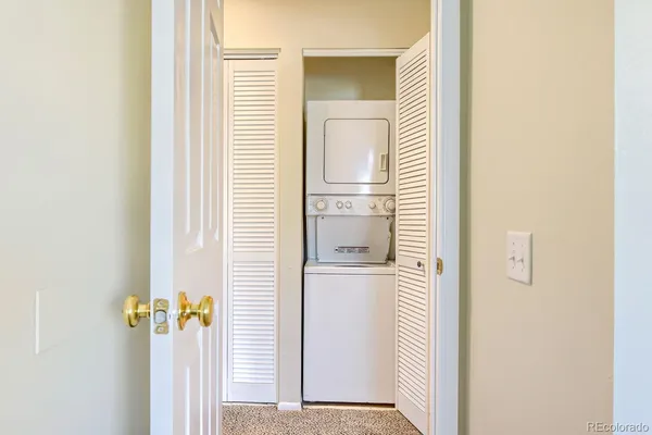 a view of a kitchen from a hallway