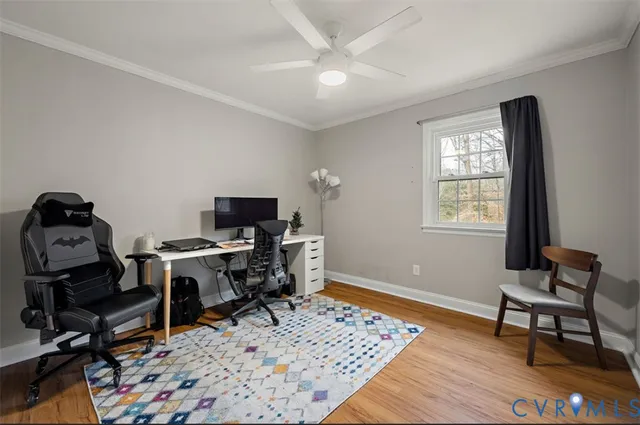 a workspace with wooden floor and a window