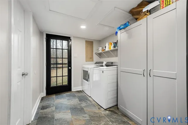 a view of kitchen with cabinets and refrigerator