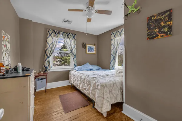 a bed room with a bed and a television