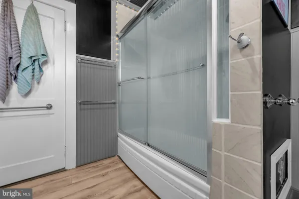 a kitchen with stainless steel appliances granite countertop a refrigerator a stove a sink and a dining table with garden view