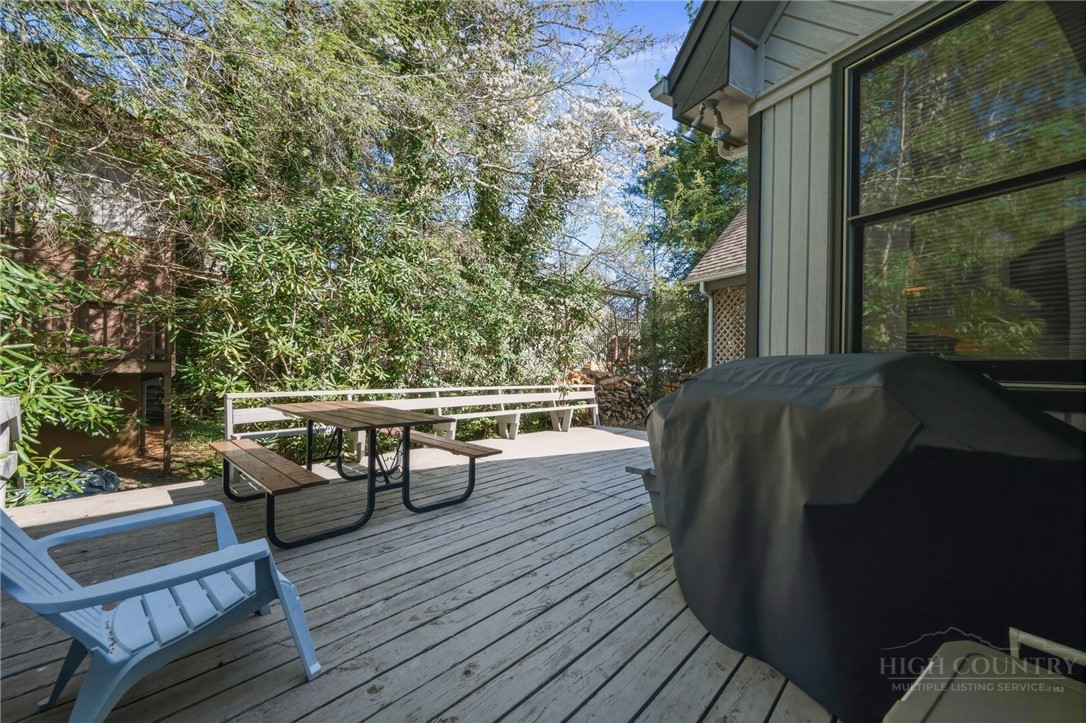 83 Pine Ridge Loop Newland, NC 28657 - Photo 29 of 32 a view of balcony with chairs and wooden fence