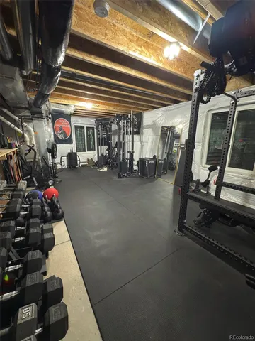 a living room with furniture and a ceiling fan
