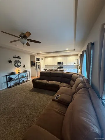 a large kitchen with stainless steel appliances granite countertop a stove a sink dishwasher and a refrigerator