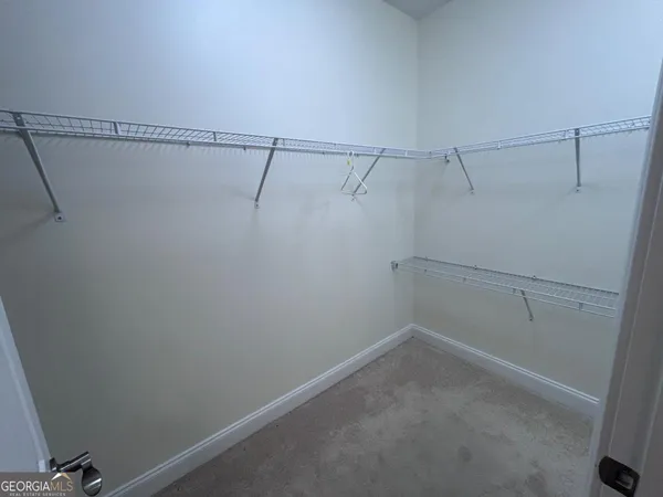 a view of a room with racks on the wall