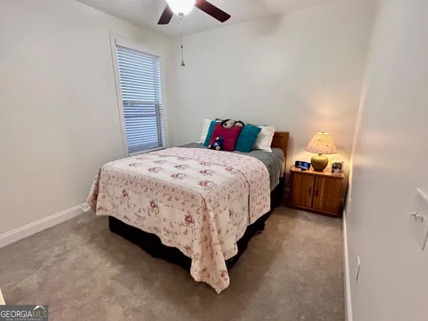 a bed room with a bed and a chandelier