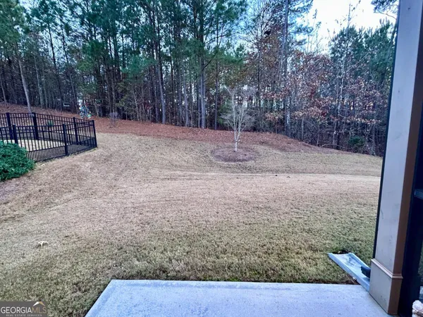 a backyard of a house with trees