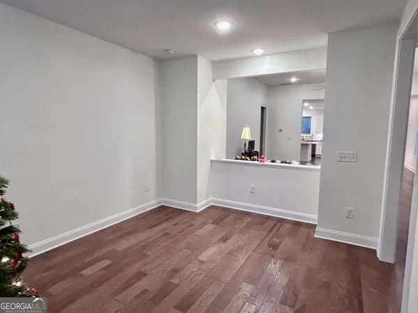 wooden floor in a room with a bathroom
