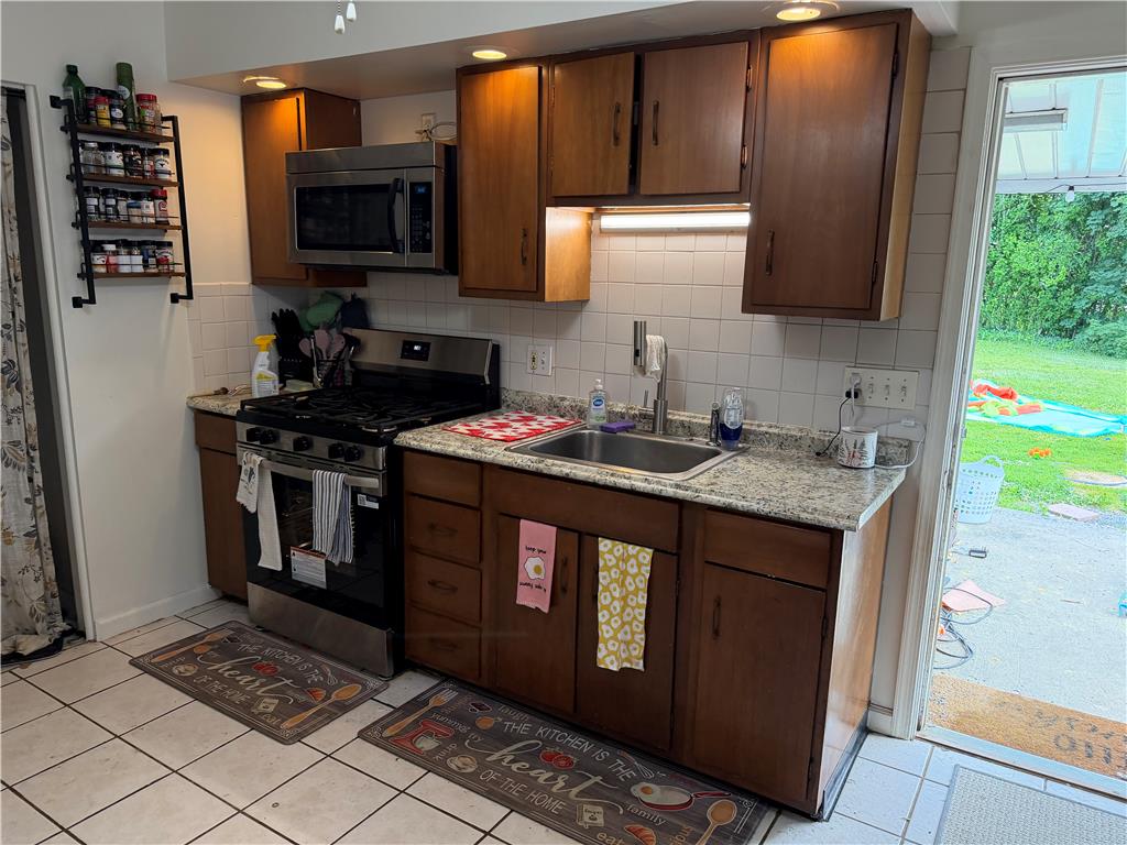 2955 Middletown Road Bethlehem, PA 18020 - Photo 9 of 21 a kitchen with stainless steel appliances granite countertop a stove sink and microwave
