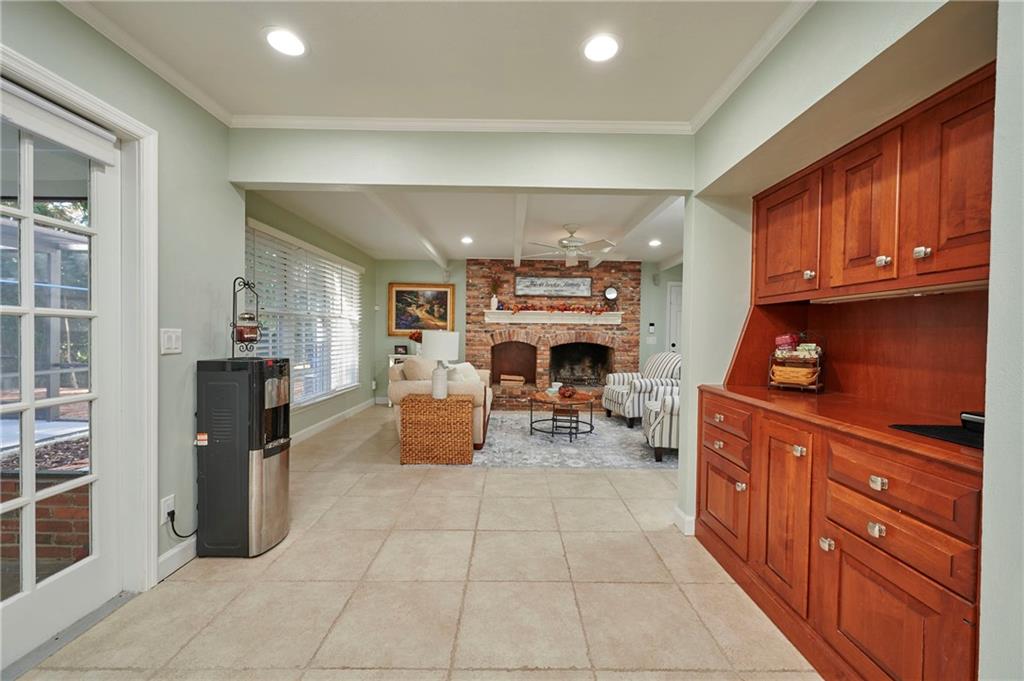 1565 48th Avenue Vero Beach, FL 32966 - Photo 12 of 34 a room with furniture a fireplace and a refrigerator