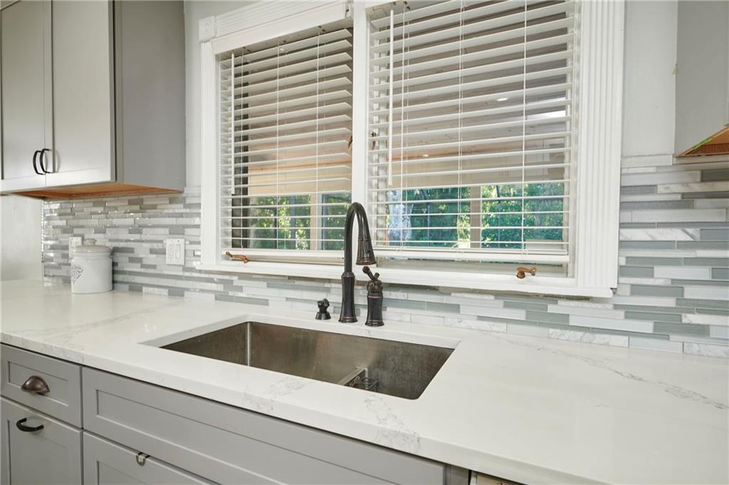 1565 48th Avenue Vero Beach, FL 32966 - Photo 14 of 34 a kitchen with a sink and a window