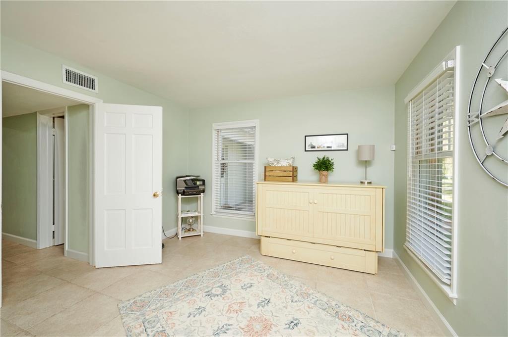 1565 48th Avenue Vero Beach, FL 32966 - Photo 26 of 34 a view of livingroom with furniture and workspace